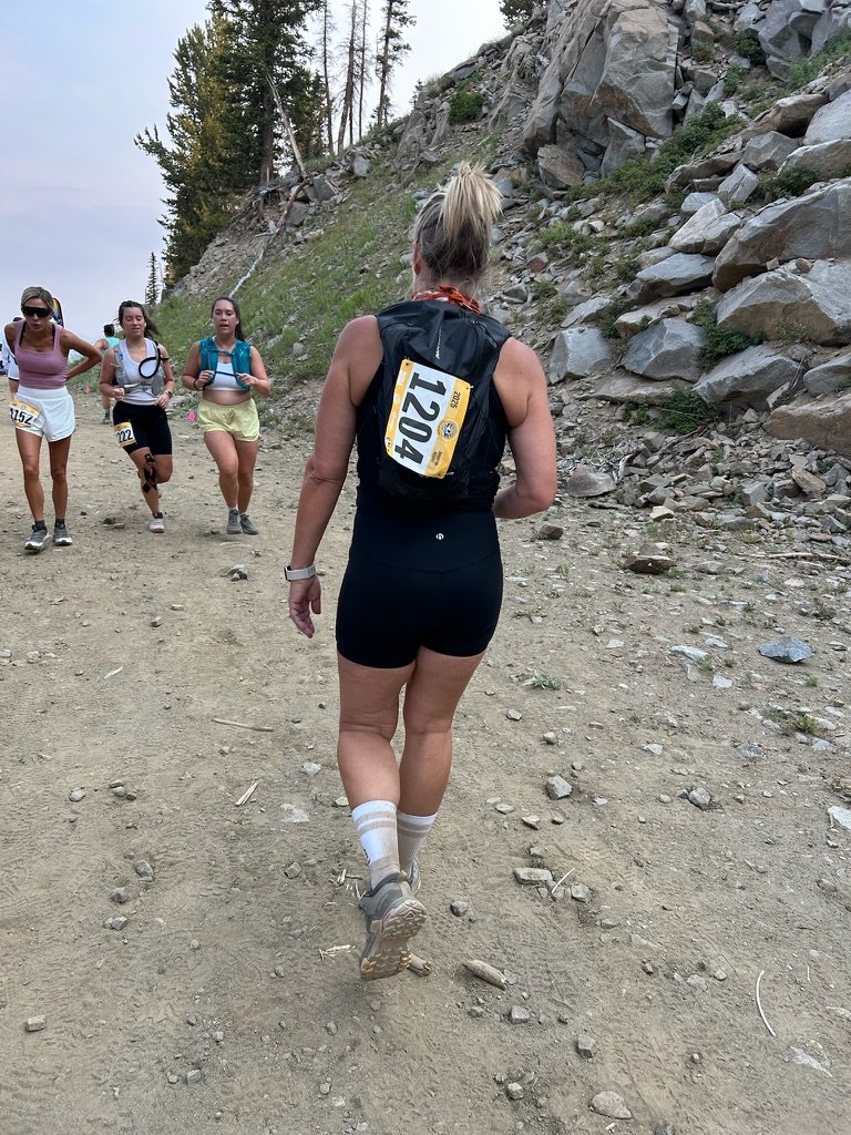 Raquel running a trail race